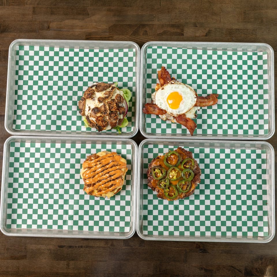 Assortment of burgers on checkered trays
